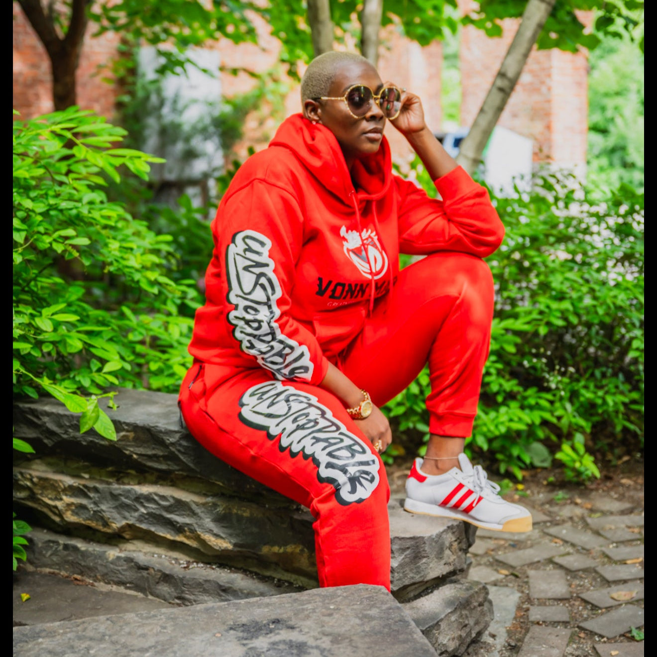 Red Flame VONN MARC Sweat suit sizes on model in vibrant red outfit, stylish urban setting.