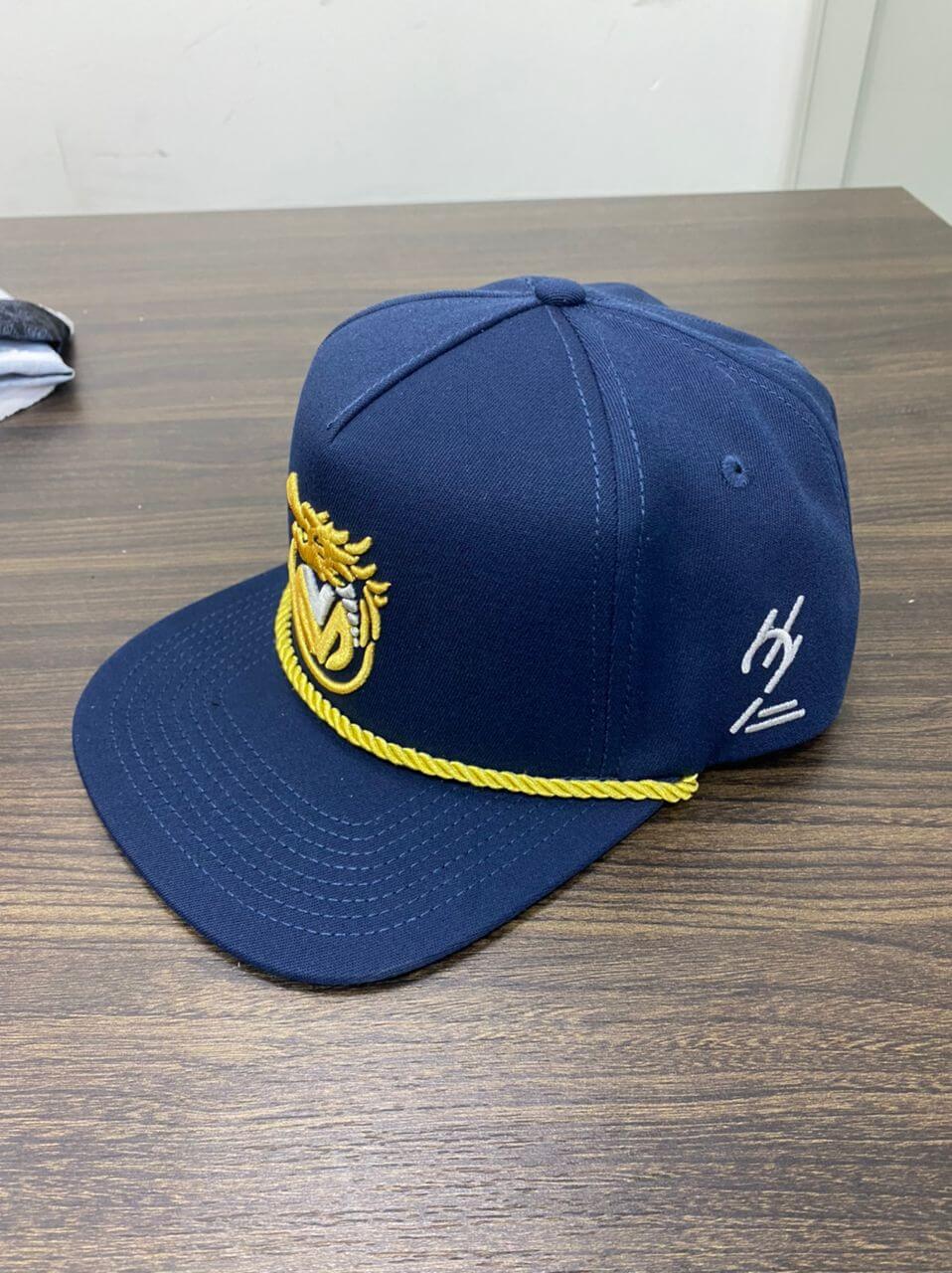 Navy blue hat with yellow embroidery and rope detail, part of a unique Hats collection.