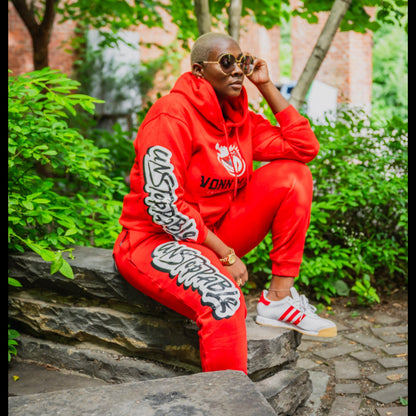 Red Flame VONN MARC Sweat suit sizes on model in vibrant red outfit, stylish urban setting.