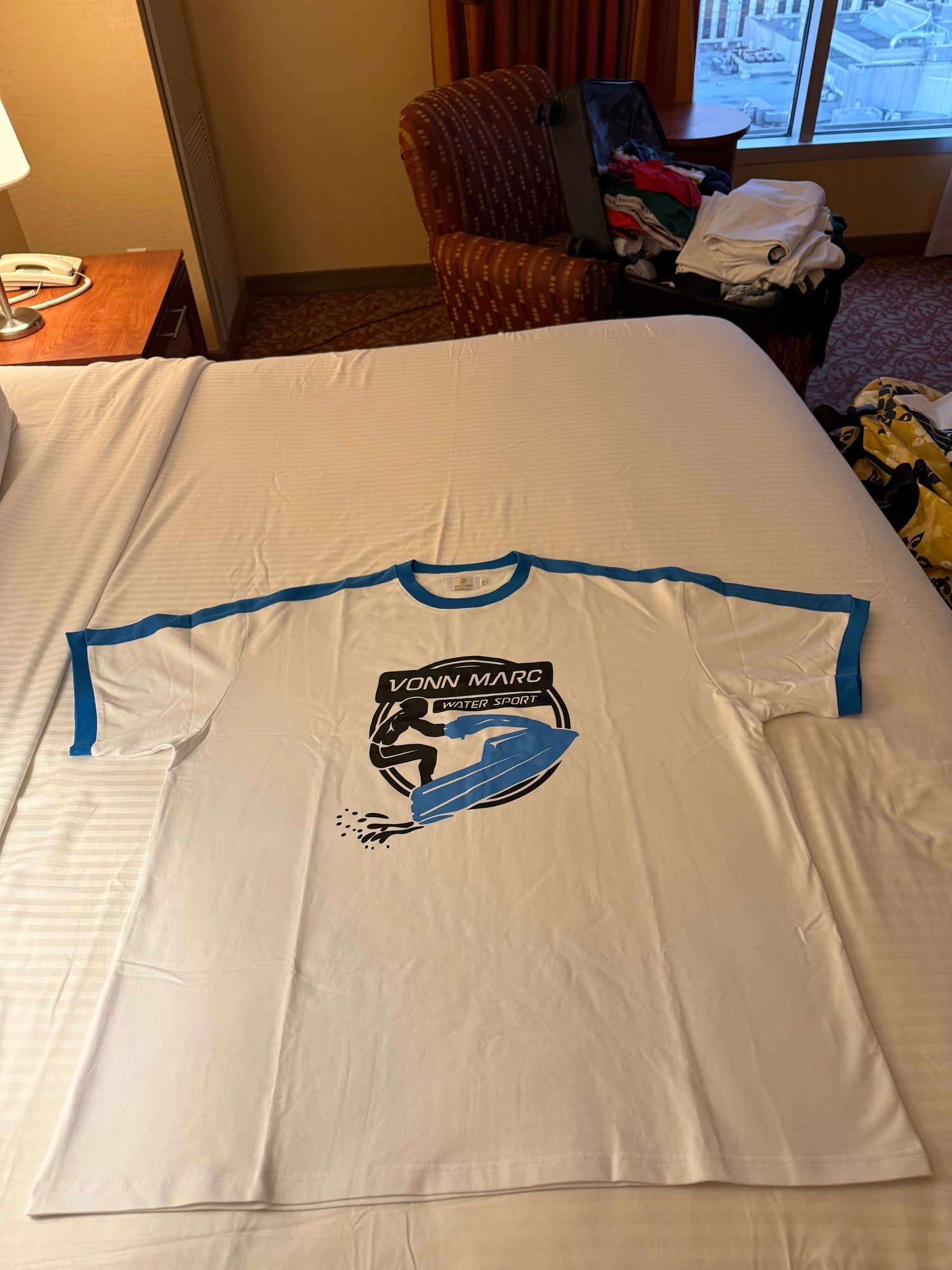 White T- Shirt Light Blue Jet Ski boat with Black logo , with built different on the back $60.00 per shirt 